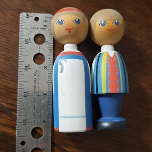 Handcrafted Wooden Doll Pair with Blue and Red Accents